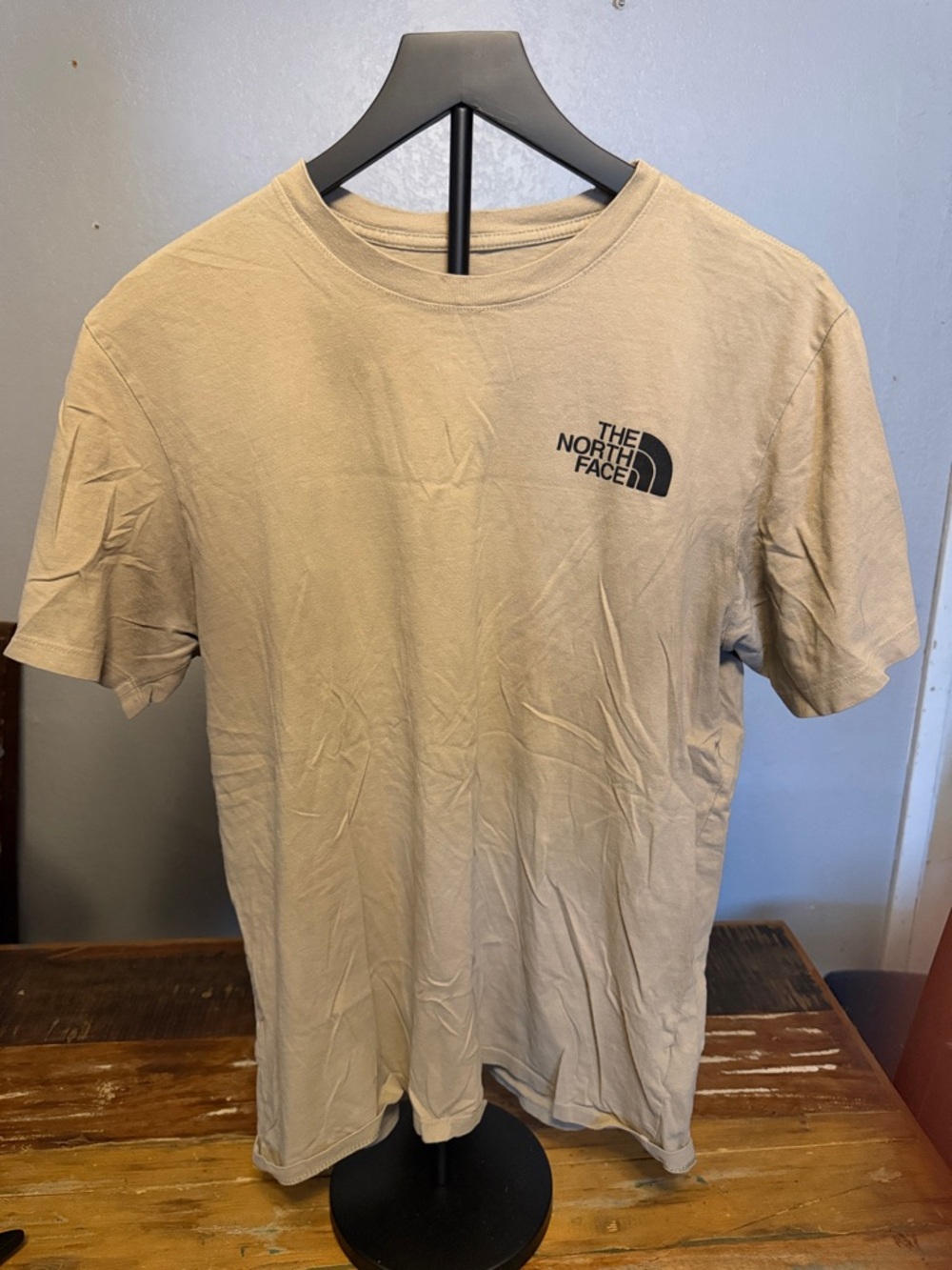 The North Face Men’s Short Sleeve Crew Tee in Beige with Black Logo